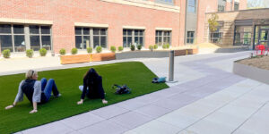 People sitting in the grass chatting at the Baystate Medical Center Hospital Roof Garden. Design by Studio 2112 Landscape Architects